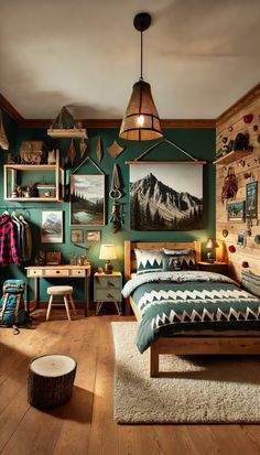 a bedroom with green walls and pictures on the wall above the bed, along with wooden flooring