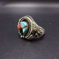 "VINTAGE NAVAJO RING DESCRIPTION: This tremendous ring features a raised inlay naja of turquoise and coral. Surrounding the inlay is a naja of sterling silver, flanked by applied leaves, scrolls, and raindrops. This fabulous ring will be a treasured addition to your collection of fine vintage Native American jewelry. MEASUREMENTS: Ring face measures 3/4\" north to south RING SIZE: 11 WEIGHT: 16.2 grams SIGNED: no STERLING: yes, stamped STERLING" Traditional Sterling Silver Rings With Inlay, Southwestern Polished Turquoise Ring Collectible, Traditional Silver Turquoise Ring With Inlay, Jewelry Measurements, Navajo Ring, Turquoise Men, Vintage Native American Jewelry, Navajo Rings, Turquoise And Coral