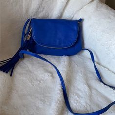 Express Royal Blue Mini Crossbody Bag With Tassel Zip. Nwot Strap Is Adjustable. 50” At Longest Length. Magnetic Button Closure With Inside Zip Pocket. Flap Is Deep Zip Pocket 8” Long X 1” Wide X 6” High Blue Shoulder Bag With Tassels For Everyday Use, Blue Shoulder Bag With Tassels For Daily Use, Blue Bag With Tassels For Everyday Use, Blue Everyday Bag With Tassels, Casual Blue Bag With Tassels, Blue Fringe Shoulder Bag For Daily Use, Blue Tassel Bags For Daily Use, Blue Fringe Bags For Daily Use, Bag With Tassel