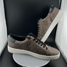 Upgrade Your Sneaker Game With These Stylish Brown Lace-Up Sneakers By Michael Michael Kors. These Sneakers Are Perfect For Women Who Want To Add A Touch Of Michael's Character To Their Wardrobe. The Upper Material Is High-Quality And Durable - See Item Description For More Details. The Closure Is Secure With Lace-Up Design, And The Shoes Are Perfect For Any Athletic Activity, Making Them Perfect For Women Who Want To Look Great While Working Out. The Michael Michael Kors Keaton Sneakers Come In Brown Sneakers With Cushioned Footbed And Flat Heel, Brown Sneakers With Cushioned Footbed, Brown Cushioned Sneakers, Brown Sneakers With Perforated Toe Box, Brown Synthetic Sneakers With Flat Heel, Brown Sneakers With Textured Sole And Flat Heel, Sneaker Games, Lace Up Sneakers, Sneaker Collection