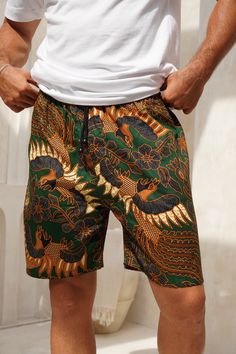 Men's Cotton Batik Drawstring Shorts Available in 5 different colours- Navy, Green, Royal Blue, Red and Red and Black Measurements- Small: Waist - 90cm (stretched out) , 55cm (not stretched) Length - 100cm Medium: Waist - 95cm (stretched out), 60cm (not stretched) Length - 103cm Large: Waist - 100cm (stretched out), 65cm (not stretched) Length - 105cm XL: Waist - 105cm (stretched out), 70cm (not stretched) Length - 107cm What you need to know: - Elasticated waistband - very stretchy, lots to give  - Drawstring tie - Pockets - Loose fit  - Made from Cotton  - Batik is made by hand using wax so there may be some imperfect ink dye marks - 5% of profits go to charity For wholesale orders you can simply and easily buy from our Faire link- weartheworld.faire.com As a thank you to all my amazing Bohemian Printed Summer Shorts, Multicolor Short Swimwear For Festival, Multicolor Hawaiian Shorts For Beach Season, Multicolor Hawaiian Short Bottoms, Multicolor Hawaiian-style Shorts, Multicolor Hawaiian Style Shorts, Tropical Cotton Shorts For Beach, Green Printed Beach Shorts, Beach Green Printed Shorts