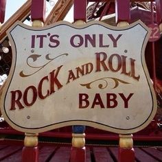 there is a sign that says it's only rock and roll baby