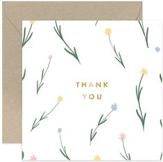 a thank card with the words thank you in gold lettering and colorful flowers on it