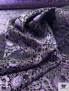 a purple and black paisley print fabric