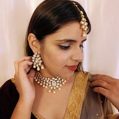 Exotic and snag-free kundan beaded necklace set with earrings. This is a stylish set with White Kundan. This set will work well with traditional, formal, and western formals. Eye-catching and unique jewelry that will set you apart. Gift this piece to a loved one, and see their face light up with joy. Best for gifting or for personal use, wear it to any occasion and become the spotlight. White color : R133C1445D418 SKU Temple Jewelry Style Chandbali Gota Work Jewelry Sets, Temple Jewelry Chandbali Sets With Gota Work, Temple Style Chandbali Jewelry Sets With Gota Work, Kundan Chandbali Temple Necklace For Formal Occasions, Kundan Chandbali Temple Necklace For Formal Events, Heavy Kundan Temple Necklace, Formal Kundan Chandbali Temple Necklace, Festive Kundan Temple Necklace For Formal Occasions, Formal Chandbali Kundan Necklace With Meenakari