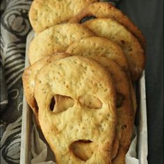 some crackers in a white container on a table