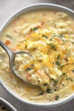 a white bowl filled with soup and a spoon