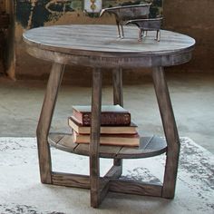 a table with books on it and a chair in the background