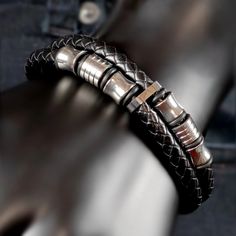 Black leather bracelet with silver metal accents and clasps. Edgy Black Leather Band Bracelet, Black Leather Strap Punk Bracelets, Black Leather Punk Bracelets, Black Leather Double Band Bracelets, The Punch, Stainless Steel Fittings, Men's Bracelets, Pearl Choker Necklace, Naha