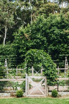 the gate is open to let people know what's in the garden behind it