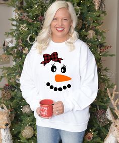 The Christmas season is almost here! Buffalo Plaid and Christmas go hand in hand. Born To Be Sassy offers this design in a variety of styles. Pair with jeans or leggings. Be the sassiest lady in this buffalo plaid snowman tee this Christmas! Fun Winter T-shirt With Crew Neck, Fun Winter Crew Neck T-shirt, Fun Crew Neck T-shirt For Winter, Fun Crew Neck Winter Tops, Cute Cotton Winter T-shirt, Fun Crew Neck Tops For Winter, Cute Cotton T-shirt For Winter, Funny White Winter T-shirt, Funny White T-shirt For Winter