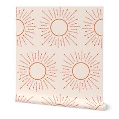 an orange and white wallpaper with sunbursts on the side, against a white background