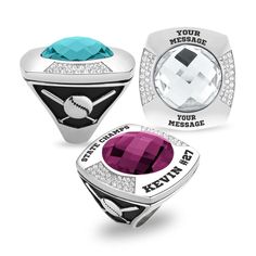 three rings with different colors and designs on the front, one has a heart shaped stone