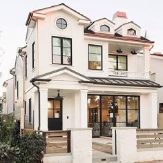 the instagram page on instagram shows an image of a white house with black shutters