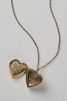 A super sweet gift or an accessory unique to you, this darling monogram necklace features a heart locket pendant with an initial engraving. **Features:** Dainty chain, heart locket pendant, hinge opening mechanism, monogram initial engraving, clasp closure **Why We | Monogram Necklace by Free People in Gold Gold Heart Locket, Book Necklace, Chain Heart, Sweet Necklace, Dainty Chain, Monogram Necklace, Sweet Gifts, Heart Locket, Things I Need