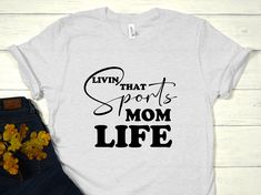 ---- Description: living that sports mom life T-shirts, mom sport shirt, sport life tees, Funny sport shirts, gift for sport mom tee, gift sport fans shirt  HOW TO ORDER  1-) Check and Review all Photos. 2-) Select Your T-Shirt Size and T-Shirt Color from drop down menus. 3-) Select Your Design Print Color from images. 4-) Choose Quantity. 5-) Click ADD TO CART. You can go back and add a different color for your family members, or you can complete the checkout. 6-) Click "Proceed to Check Out" 7 Sporty Graphic Print T-shirt For Mother's Day, Letter Print T-shirt For Light Sports During Sports Season, Letter Print T-shirt For Light Sports And Sports Season, Sporty White T-shirt For Mother's Day, White Sporty T-shirt For Mother's Day, Mother's Day Sports T-shirt With Letter Print, Funny Sports Shirts, Sport Life, Sport Mom