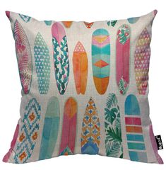 a pillow with colorful surfboards on the front and back of it, all in different colors