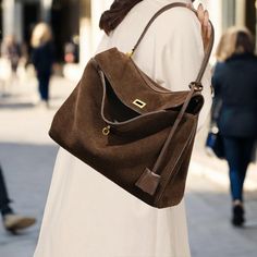 Discover our luxurious Suede Leather Tote Bag--the ultimate blend of style and practicality. Crafted from premium suede, this shoulder bag is soft to the touch, offering a timeless slouchy silhouette perfect for any occasion. 🌟 Available in beautiful shades of Caramel, Coffee, and Dark Brown, this bag comes in two versatile sizes to fit all your essentials: Small: 28 x 10 x 19 cm (11 x 3.9 x 7.5 in) Large: 35 x 11 x 23 cm (13.8 x 4.3 x 9.1 in) Looking for more? I have additional styles and colors available in high-quality suede and leather. Want extra photos or videos to make your choice easier? Just message me privately, and I'll be happy to share! 😊 Luxury Everyday Handheld Baguette Bag, Luxury Large Capacity Handheld Baguette Bag, Luxury Large Capacity Hobo Shoulder Bag, Elegant Large Capacity Baguette Bag For Travel, Luxury Handheld Shoulder Bag For Fall, Elegant Baguette Bag With Large Capacity For Travel, Luxury Handheld Bags For Fall, Elegant Fall Tote Baguette Bag, Luxury Handheld Hobo Bag For Office