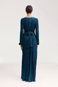 Indulge in the splendor of the Samara Pleated Wrap Waist Maxi Dress in Lapis Blue. This luxurious dress features an elegant plisse satin fabric, artfully pleated wrap waist, and a feminine ruffle hem. Elevate your style with this exquisite piece. Model is 5'7" and is wearing size XS/58". Luxurious Dress, White Dress Formal, Dresses Flowy, Nikkah Dress, Luxurious Dresses, Lapis Blue, Engagement Dresses, Dress Satin, Kids Outerwear