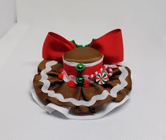 Gingerbread mini hat for girls, adults and pets. Mini hat size is approximately 3.5 inches wide by 1.5 inches high. The hat can be attached to a metal alligator clip, a soft headband or ribbon for pets. Please choose the finish: -5/8 by 16 or 18 inches soft headband -2.6 inches metal alligator clip -3/8 by 18 or 25 inches ribbon. -There may be slight variation in size -Due to lighting color may vary slightly -All mini hats are made in a smoke free environment -Every hat is handcrafted by me. *Please feel free to contact the seller if you have a question **Hats are ready to ship the next business day -All mini hats will be shipped in a box. Adjustable Christmas Hat As Gift, Adjustable Mini Christmas Hats, Novelty Mini Hats In Red For Gifts, Novelty Mini Red Hat For Gift, Adjustable Brown Mini Hats As Gifts, Adjustable Brown Mini Hats As Gift, Adjustable Brown Mini Hat As Gift, Holiday Mini Hats With Headband, Holiday Mini Hat Headband