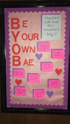 a bulletin board that has been decorated with notes, hearts and words for valentine's day