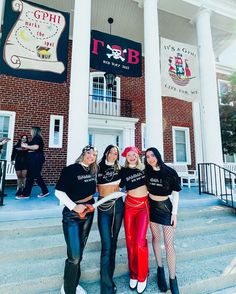 three girls are standing on the steps in front of a brick building with white pillars