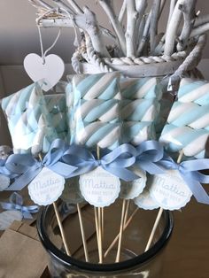 blue and white striped lollipops in a vase