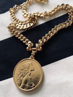 "⚜️NEW COLLECTION 2023⚜️ ✨EXPRESS SHIPPING OVER 100$ FREE Item Overview Handmade item Made to order. DETAILS High quality 2 micron 24k gold micron plating Lead Free and Nickel Free MEASURES Coin size: 40mm / thickness 4 mm Chain width- 7-8 mm GODDESS CURB NECKLACE Can goes along your favorite necklace you wearing daily for \" layered\" look or just by it self for \"clean\" and classy look. As a gift , will be beautiful for your best friend birthday, sister wedding, mom anniversary or your lovely Elegant Medallion Necklace With Chunky Chain, Elegant Necklace With Chunky Chain And Medallion, Gold-tone Cuban Link Metal Necklace, Elegant Medallion Necklaces With Curb Chain, Elegant Medallion Curb Chain Necklaces, Gold Plated Gold Chain Necklace, Gold-tone Chunky Cuban Link Necklace, Gold-tone Chunky Cuban Link Chain Necklace, Gold-tone Cuban Link Chunky Chain Necklace