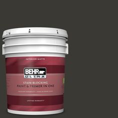 the behr ultra stain and primer in one is shown on a brown background