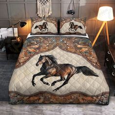 a bed with a horse on it in a room next to a night stand and lamp