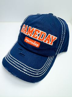 Introducing our Blue/Orange Gameday Ball Cap The perfect blend of sporty style and comfort, designed to make your game day outfit stand out. Whether you're cheering from the stands or running errands, these hats are a must-have for any fan. Key Features: Classic baseball cap design with an adjustable strap for a perfect fit High-quality, durable fabric for long-lasting wear Comfortable fit for all-day wear White stitching on hat gives it a fun look Fast shipping from Texas ensures you’re ready f Casual Blue Trucker Hat For Game Day, Blue Casual Snapback Hat For Game Day, Casual Blue Hat For Game Day, Casual Snapback Hat With Letter Print For Game Day, Sporty Game Day Trucker Hat With Visor, Sporty Blue Baseball Cap For College, Casual Game Day Baseball Hat, Casual Snapback Hat For Game Day, Casual Snapback Baseball Cap For Game Day