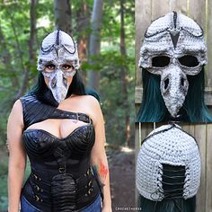 a woman with green hair wearing a white mask and black leather corset,