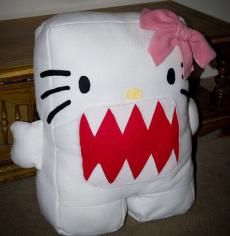 a hello kitty stuffed animal sitting on top of a table