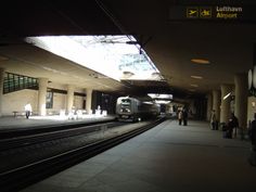 the train is pulling into the station at night