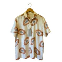 Folk Men’s Drake Short Sleeve Shirt Style: “Drake” Short Sleeve Color: Ecru With Terra Cotta And Black Floral Pattern Fabric: 55% Linen, 45% Viscose Size: Small Chest: 22.5” Across, Laid Flat Waist: 23” Across Shoulders: 18.5” Shoulder Seam To Seam Length: 28” Detail: British Modern Style Button Front Collared Neckline Breathable Lightweight Fabric New With Tags. Casual Cream Shirt With Spread Collar, Cream Short Sleeve Shirt With Button Closure, Cream Spread Collar Top For Summer, Collared Cream Shirt For Summer, Cream Collared Shirt For Summer, Summer Cream Collared Shirt, Short Sleeve Linen Shirt With Floral Print, White Linen Shirt With Floral Print, Cream Short Sleeve Workwear Shirt