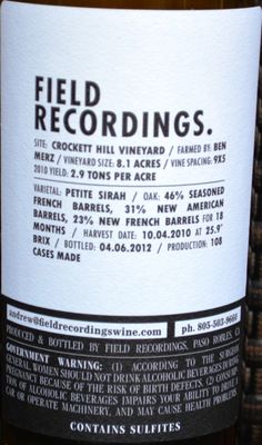 a close up of a bottle of wine with labels on the front and back of it