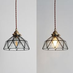 two pendant lights with one light turned off and the other turned on in different directions