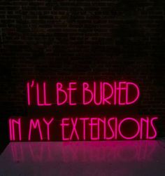 a neon sign that says i'll be buried in my extensions