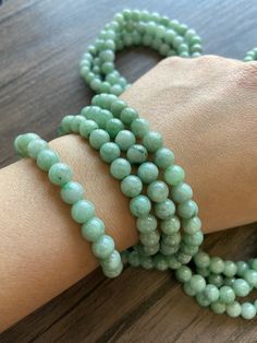 🌈 Jadeite Beaded (7.2mm) Necklace Bracelet, Green Jade, 108 beads 🌷 Untreated Natural Jadeite/ Grade A Jade 🌷 Jade from Myanmar/ Burma 🌷 100% handmade carving 🌷 Bead size : 7.2 mm 🌷 Number of Beads : 108 🌷 Color : Green 🌷 Free shipping from Hong Kong with tracking number provided 🌷 Take approximately 7-28 days to arrive worldwide ❤️ In Chinese Culture: Young people wear jade pendant will have a prosperous life, attracts good luck and friendship Old people wear jade pendant will have a h Spiritual Single Strand Bracelet With Round Beads, Green Single Strand Beaded Bracelet With Round Beads, Green Single Strand Round Beaded Bracelets, Hand-strung Amazonite Beaded Bracelets, Hand-strung Aventurine Beaded Bracelets, Jade Round Beads With Natural Stones, Natural Jade Round Beads, Amazonite Gemstone Beaded Bracelets, Lavender Green