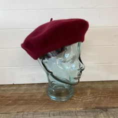 This 100% Wool Beret in Burgundy is a classic style that makes a stylish fashion statement. You cannot go wrong with this shape.  This classic design will add flair to any outfit, whilst also protecting you from the elements.   Keeping you warm and ensuring you look great! Made from 100% pure new wool 28cm diameter, one size fits most, stretches to fit from 55cm to 61cm. Classic Short Brim Beret For Fall, Classic Winter Beret, Classic Beret For Winter, Classic Fitted Wool Beret, Classic Fitted Beret For Winter, Classic Fitted Winter Beret, Classic Fitted Beret With Short Brim, Yellow Beret, Wine Barrel Table