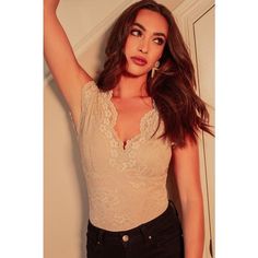 The Lace Sleeveless Bodysuit and a pair of high-waisted jeans are the perfect match! Featuring a scalloped V neckline and a deep open back, this bodysuit can easily be dressed up or down. For a chic vibe, pair with a sleek mini skirt for a gorgeous go-to date night look. 92% Nylon, 8% Spandex, Lining: 100% Polyester Size+Fit: (Measurements are approximate and taken with material unstretched)- If you are bigger chested, we recommend sizing up.- Size S: Chest 32", Waist 28"- Size M: Chest 33", Wai Sleeveless Bodysuit, Night Looks, High Waist Jeans, Perfect Match, Open Back, Date Night, Mini Skirt, Camisole Top, Mini Skirts