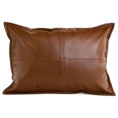 a brown leather pillow on a white background