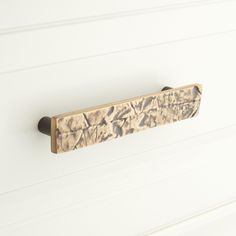 a close up of a door handle on a white wall