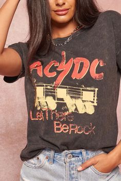 Mineral-washed graphic t-shirtVintage-style AC/DC logo print with guitar graphic and "Let There Be Rock" text.Round neckline.Short drop-shoulder sleeves.Loose fit.100% Cotton.Imported top designed and printed in Los Angeles, CA.Officially ... Concert Clothes, Ac Dc Logo, Acdc Logo, Dc Logo, Guitar Graphic, Rock Concert, 2024 Fashion, Cute Tshirts, Charcoal Color