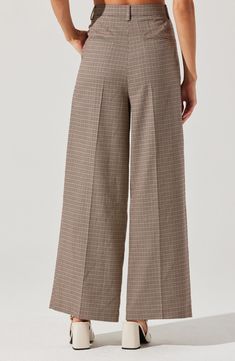 A crisp houndstooth check brings preppy polish to wide-leg pants complete with tasteful pleats and plenty of pockets. Zip fly with hook-and-bar closure Front slant pockets; back welt pockets 97% polyester, 3% elastane Dry clean Imported Chic Plaid Wide Leg Pants, Formal Plaid Wide Leg Bottoms, Classic Houndstooth Bottoms For Workwear, Elegant Spring Pants With Houndstooth Pattern, Classic Houndstooth Bottoms For Work, Elegant Houndstooth Pants For Spring, Elegant Plaid Pants For Workwear, Elegant Plaid Wide-leg Pants, Elegant Spring Houndstooth Pants