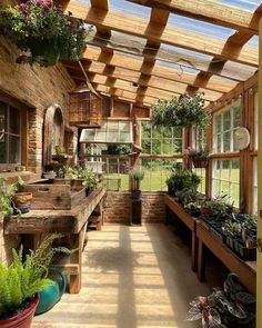 the inside of a house with many potted plants on the windowsill and wooden beams