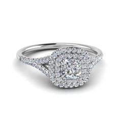 a cushion cut diamond engagement ring with halos