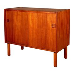 a wooden cabinet sitting on top of a white background