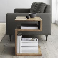 a living room with a couch, table and chair