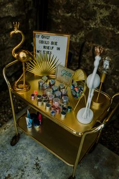 there is a gold tray with candles and other items on it, including a sign that says if only we could see relief in my life